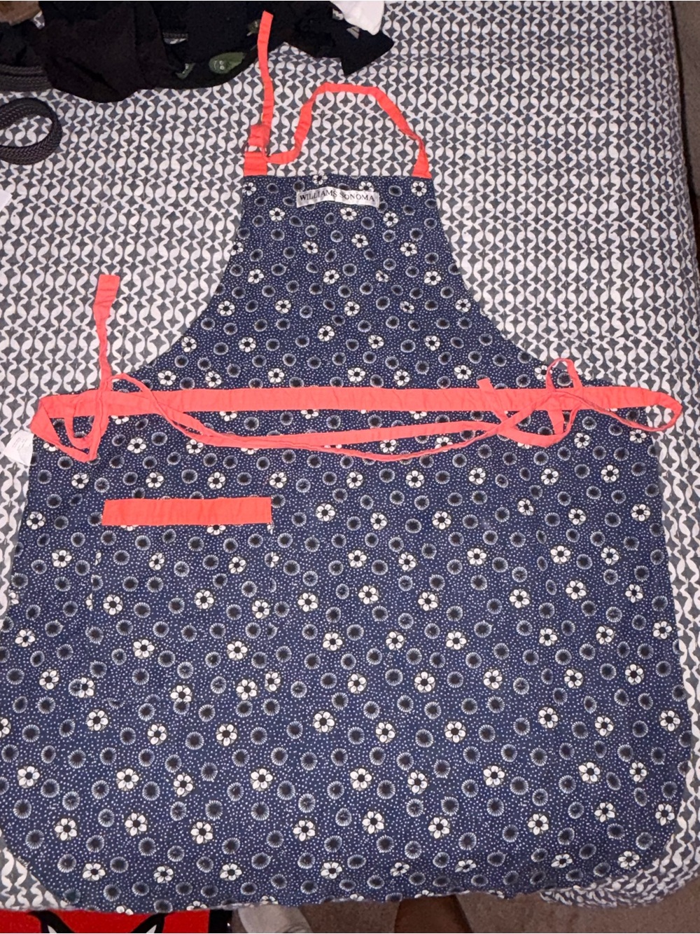 Williams Sonoma navy floral apron with coral trim